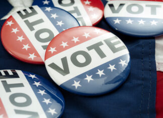 Democrat Vs Republican Poll, Democratic Decision And Primary Voting Conceptual Idea With Vote Election Campaign Button Badges And The United States Of American Flag