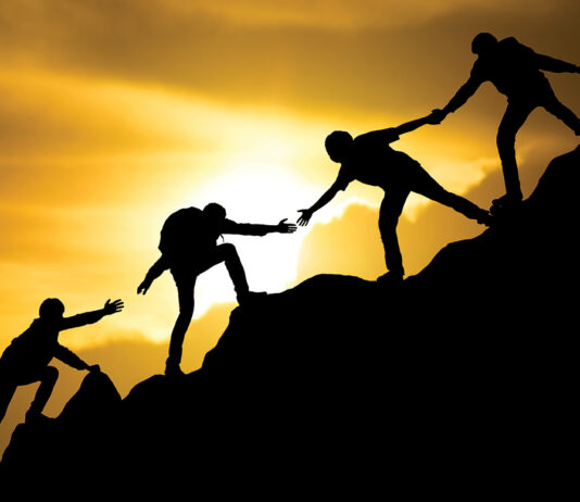 Group Of People On Peak Mountain Climbing Helping Team Work , Travel Trekking Success Business Concept
