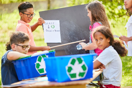 Children's Group In A Waste Glass Recycling Campaign