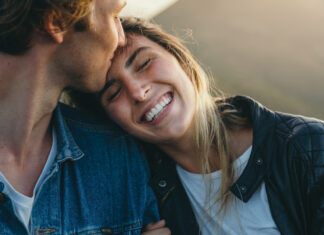 Romantic Boyfriend Kissing On Happy Girlfriend's Forehead