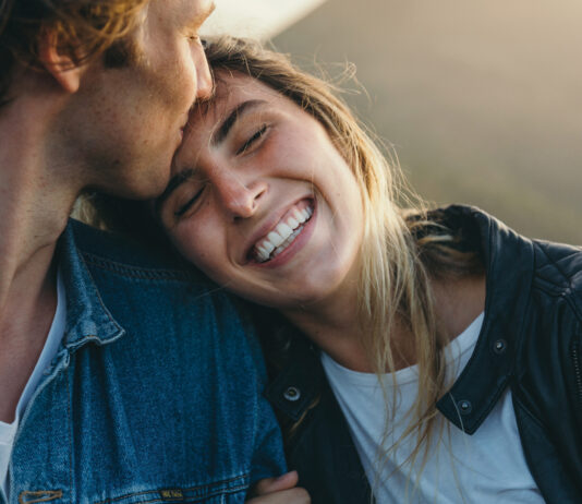 Romantic Boyfriend Kissing On Happy Girlfriend's Forehead