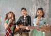 Band Of Little Musicians Against Grunge Wall