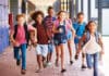 FLIGHT 250: A September Brief School Kids Running In Elementary School Hallway, Front View